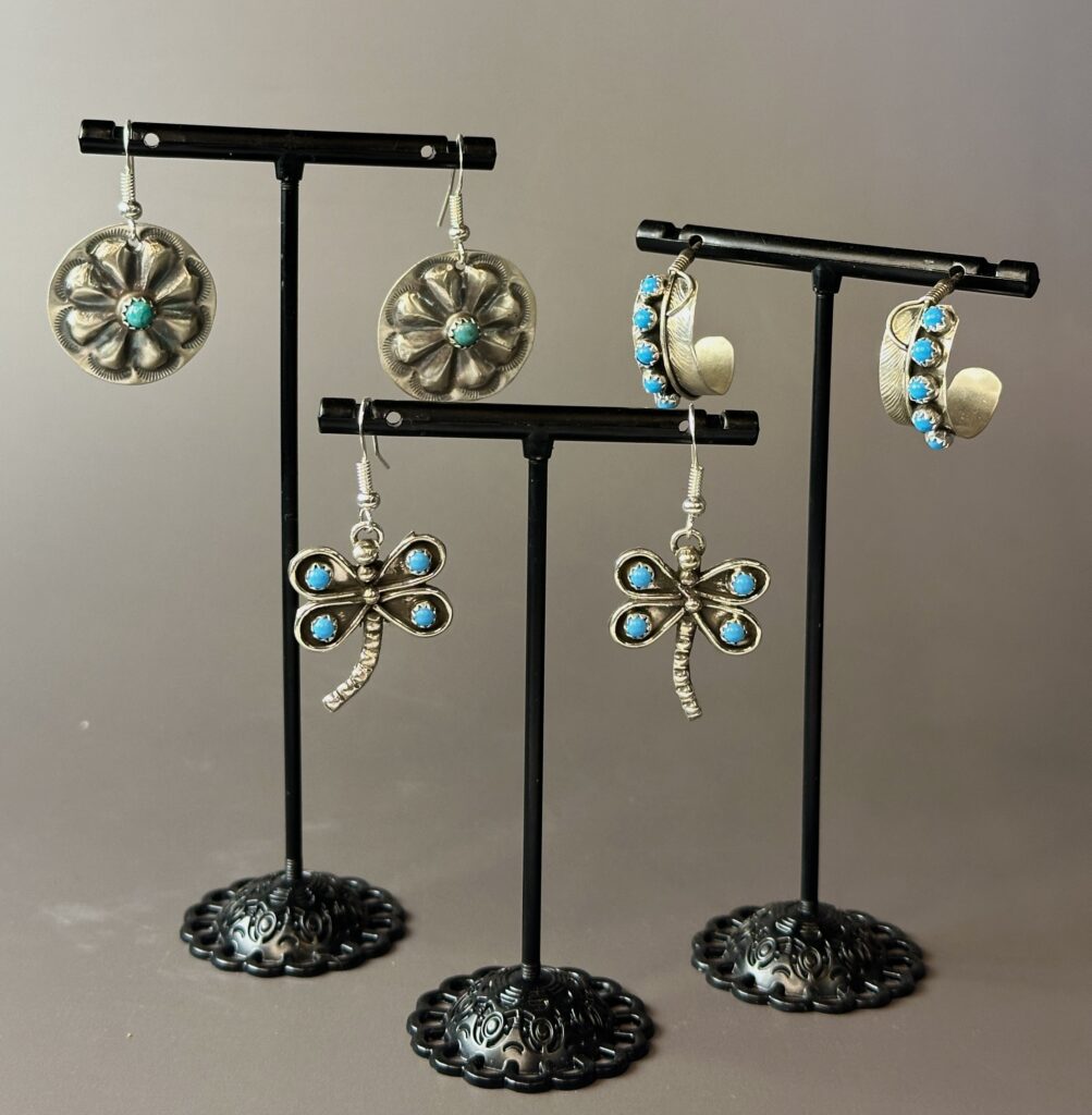 Sterling silver and turquoise earrings on display stands